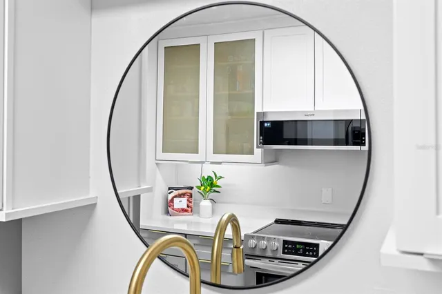 a bedroom with a bed and a lamp