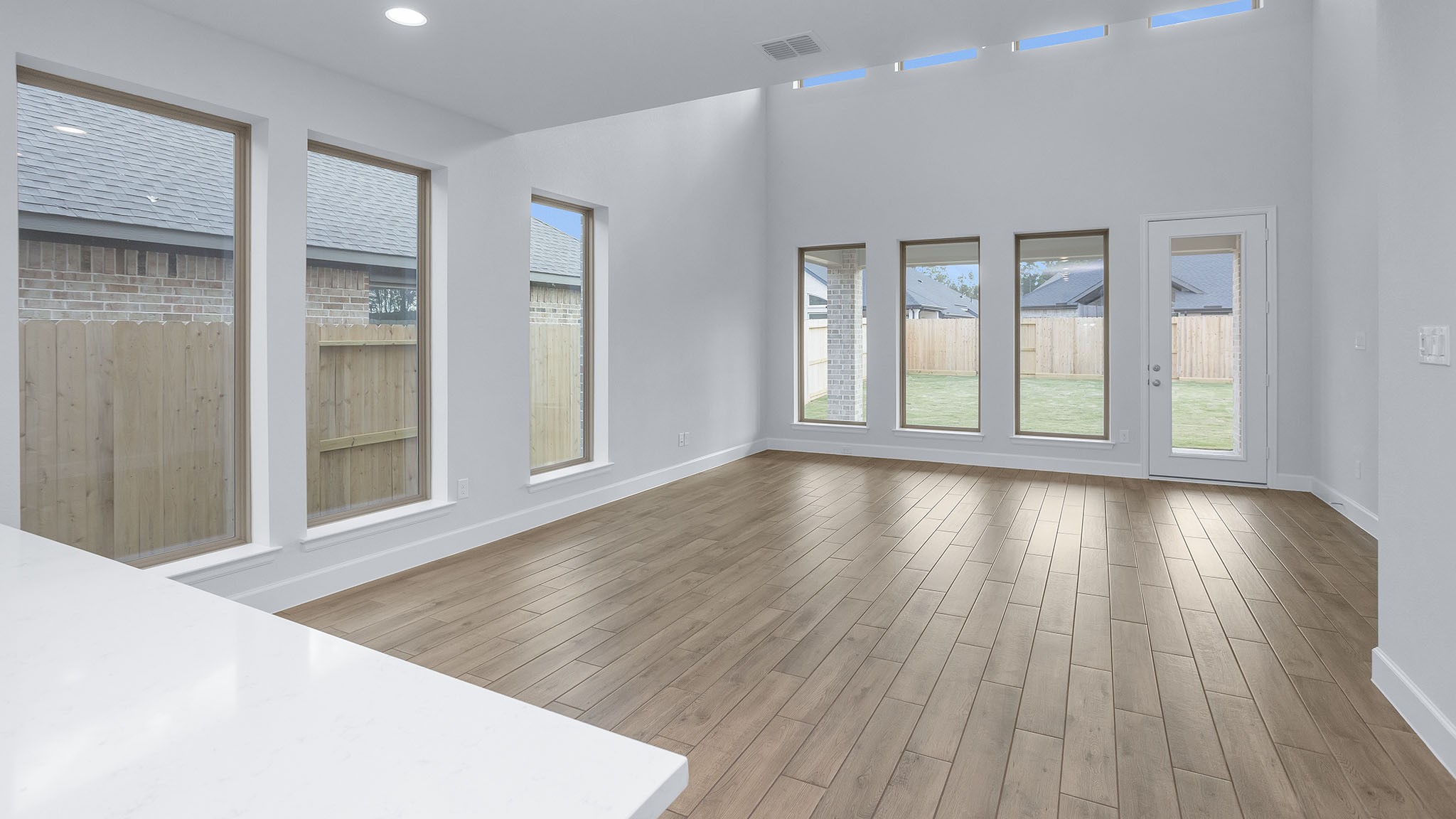 9620 Mount Brewer Lane Porter, TX 77365 - Photo 14 of 25 wooden floor in an empty room with a window