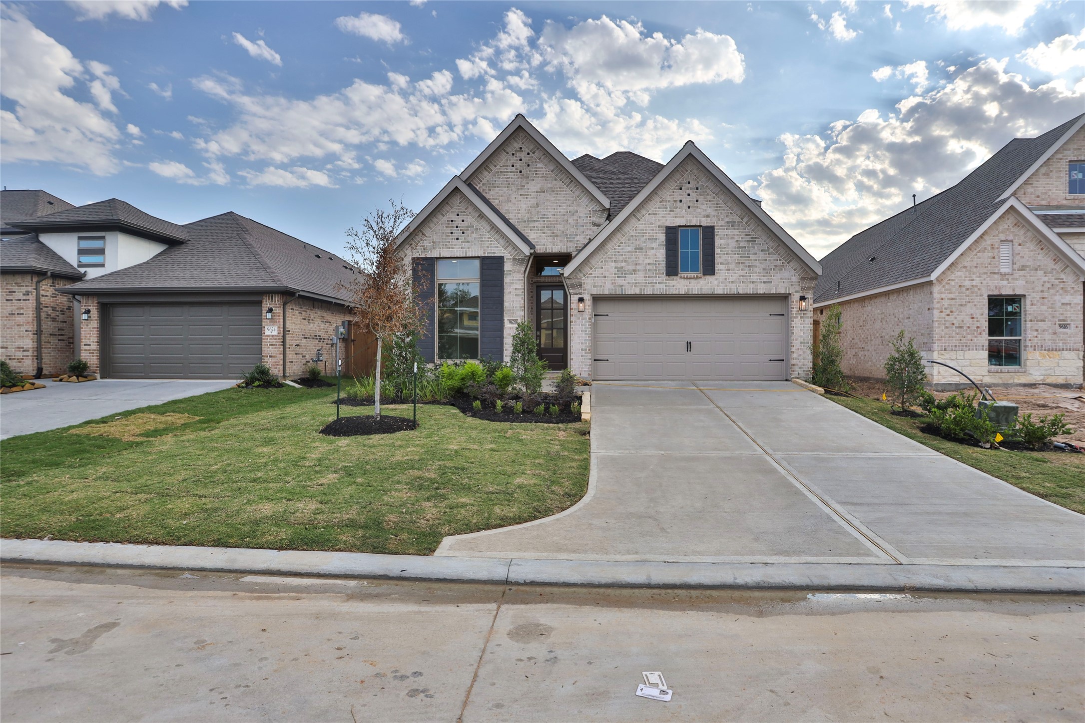 9620 Mount Brewer Lane Porter, TX 77365 - Photo 18 of 25 a front view of a house with a yard and garage