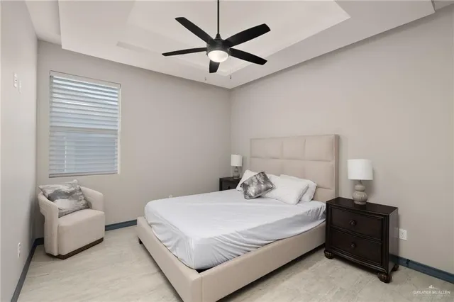 a bedroom with a bed and a couch