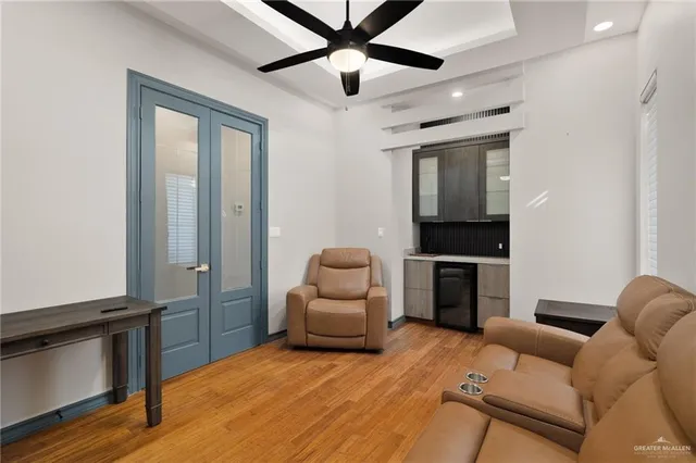 a bedroom with furniture and wooden floor