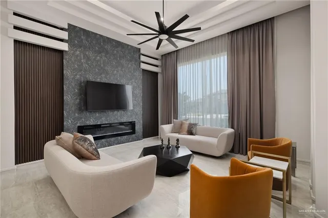 a living room with furniture and a flat screen tv