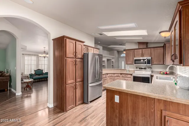 a kitchen with a refrigerator and a sink
