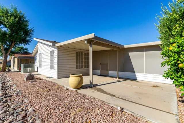 a house with trees in the background