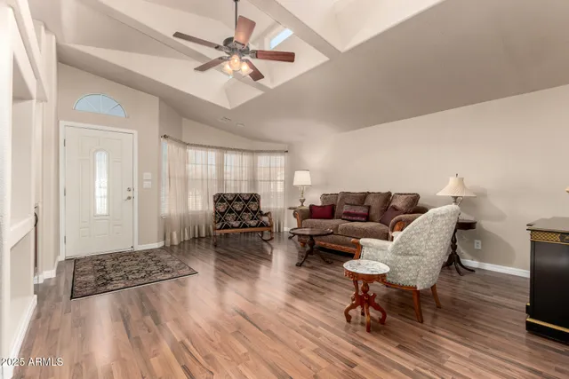 a living room with furniture and a rug