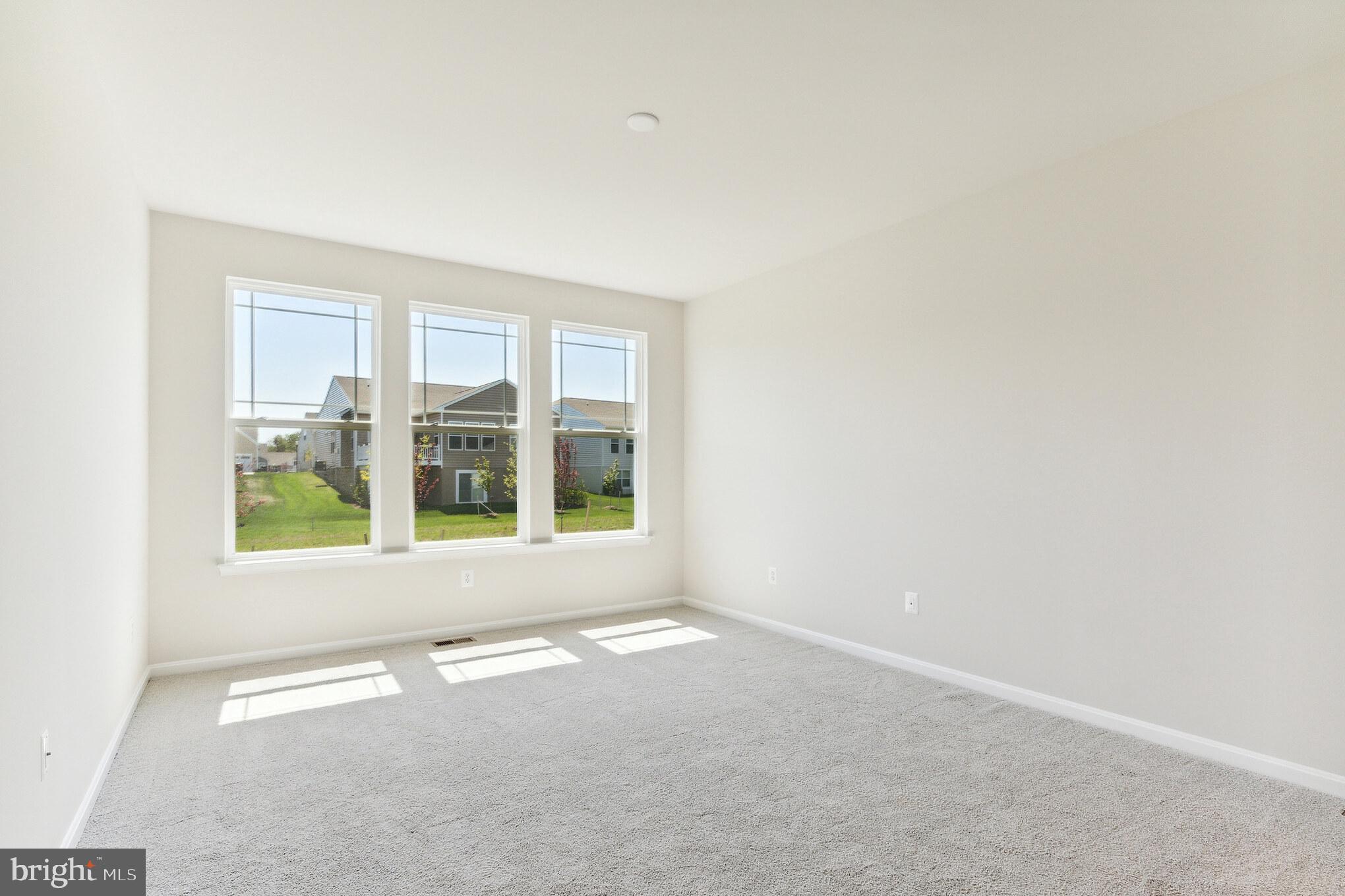 19 Golden Raintree Court Middletown, DE 19709 - Photo 10 of 30 an empty room with a windows and entrance