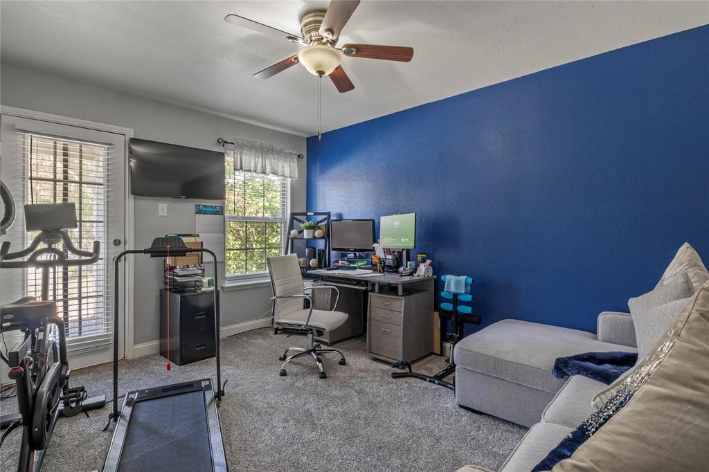 8342 Timberbrook Lane Dallas, TX 75249 - Photo 18 of 25 a view of a workspace with furniture and a window