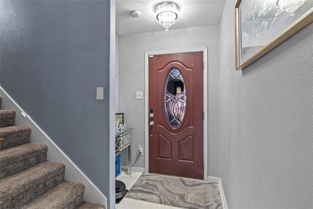 8342 Timberbrook Lane Dallas, TX 75249 - Photo 3 of 25 a view of a hallway with washer and dryer