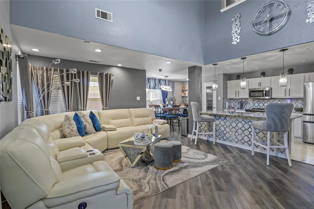 8342 Timberbrook Lane Dallas, TX 75249 - Photo 4 of 25 a living room with furniture and a large window