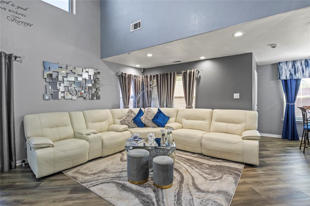 8342 Timberbrook Lane Dallas, TX 75249 - Photo 5 of 25 a living room with furniture and a large window