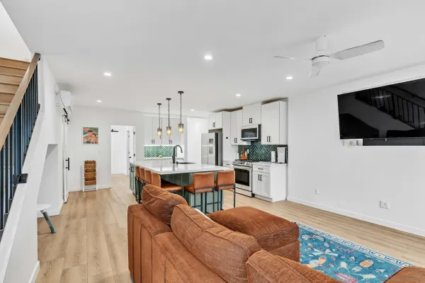a living room with furniture and a rug