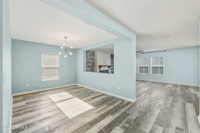 a kitchen with stainless steel appliances granite countertop a refrigerator a stove and a sink