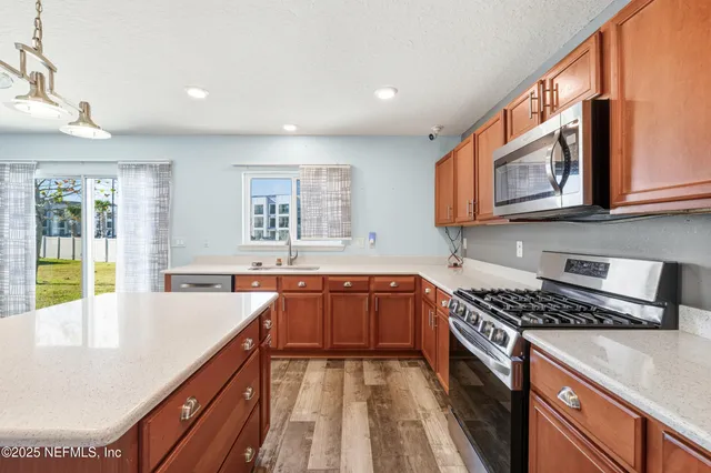 a bedroom with a bed and a ceiling fan