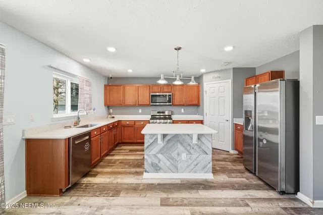 a bathroom with a tub sink and mirror