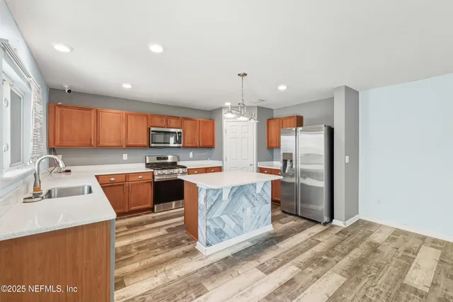 a bathroom with a sink a toilet a mirror and vanity