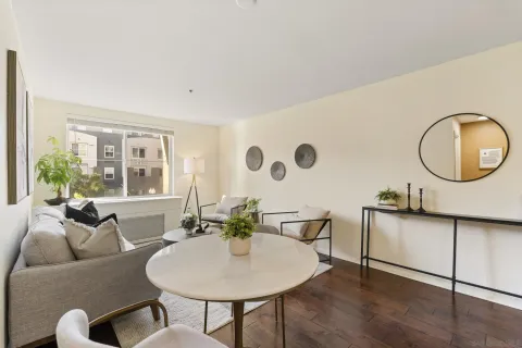 a living room with furniture and a large window