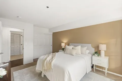 a bedroom with a bed and a chair