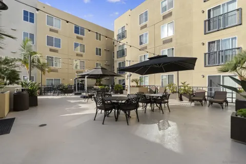 a view of a building with sitting area