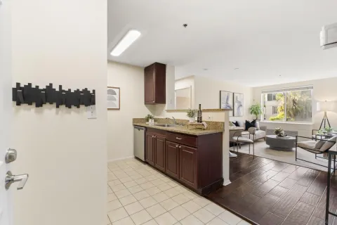 a spacious bathroom with a granite countertop sink and a mirror