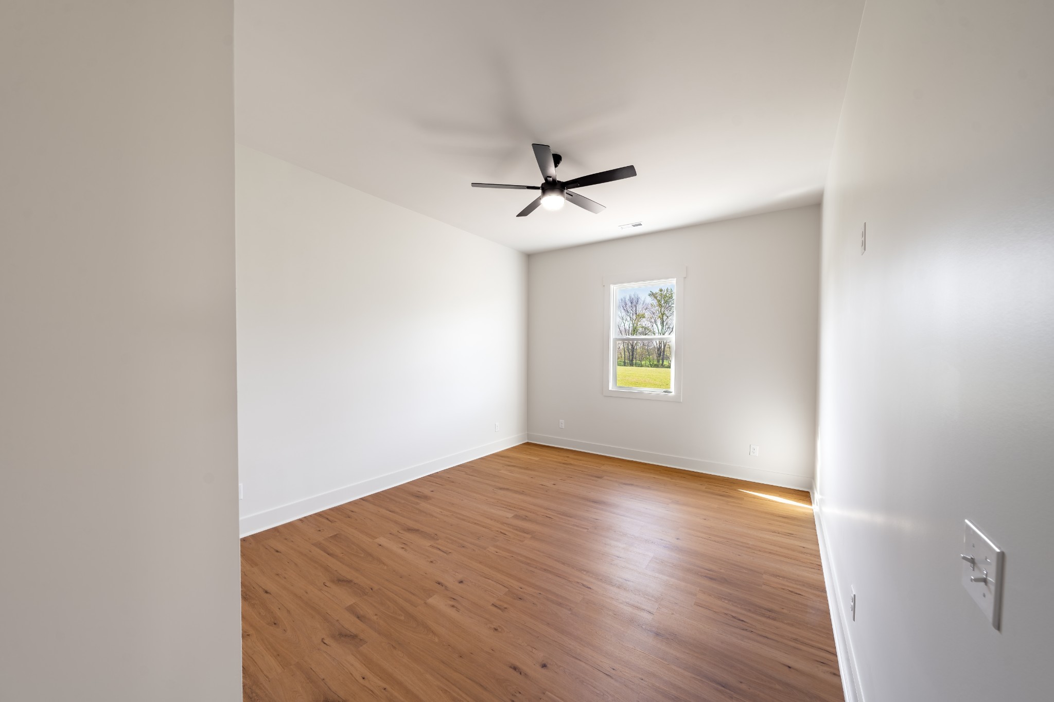 4031 Wells Road Springfield, TN 37172 - Photo 18 of 39 wooden floor in an empty room with a window