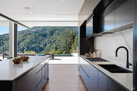 a room with a table or chairs and a floor to ceiling window