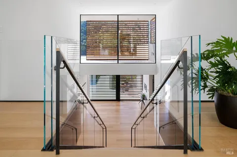 a living room with couch and a floor to ceiling window