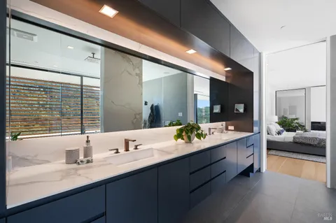 a bathroom with a bathtub and potted plant