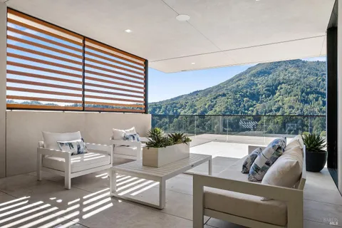 a bedroom with a large bed and a couch