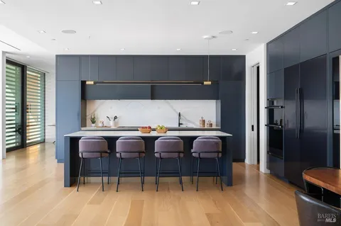 a kitchen with a sink and a stove top oven