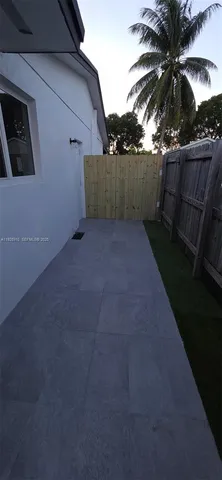 a view of backyard and entertaining space