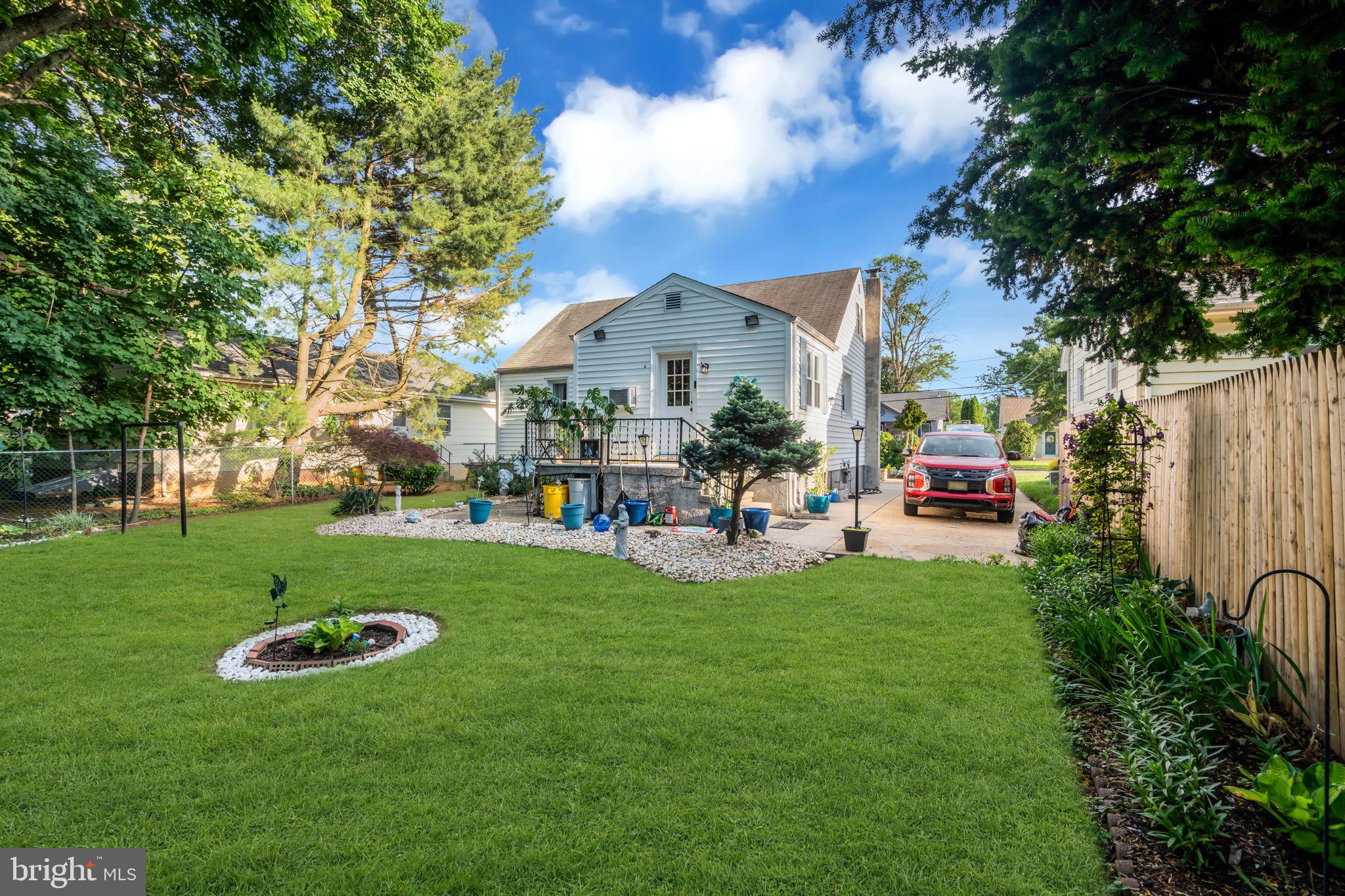 80 Locust Avenue Hamilton, NJ 08620 - Photo 23 of 24 a view of a house with garden and a cars park