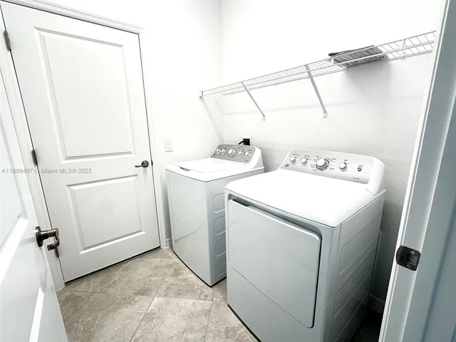 a utility room with dryer and washer