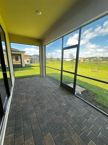 a view of empty room with floor to ceiling window
