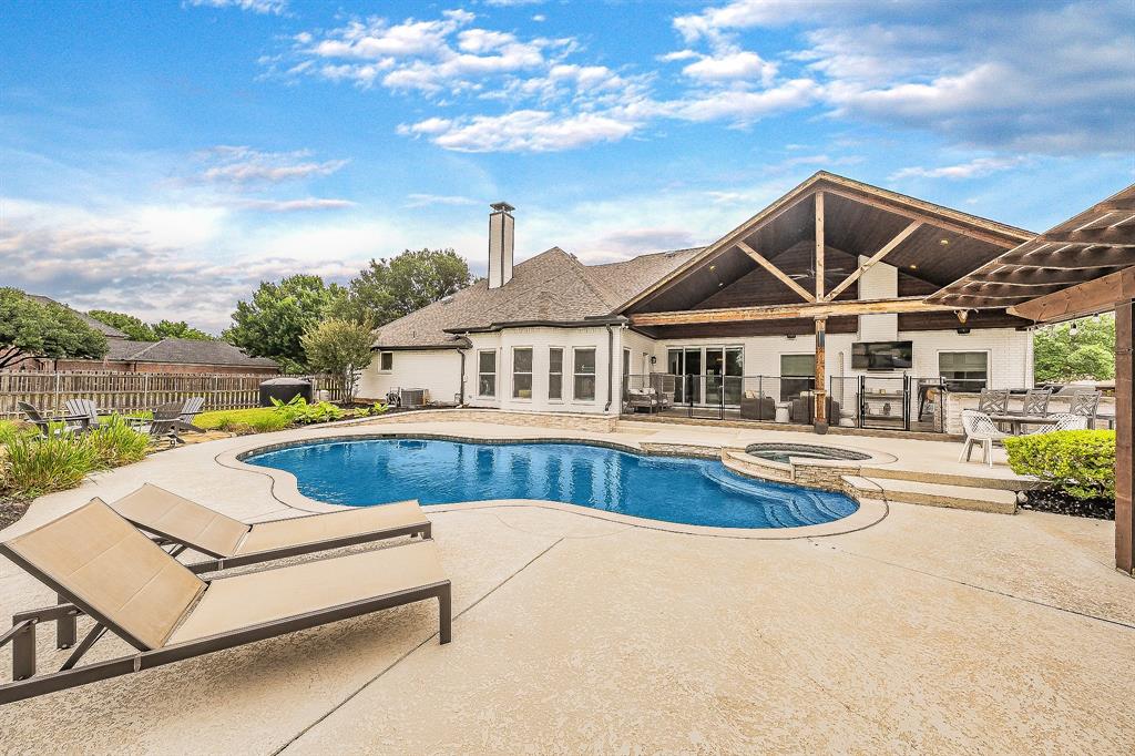 115 Pheasant Run Road Argyle, TX 76226 - Photo 4 of 40 a view of a house with swimming pool and sitting area