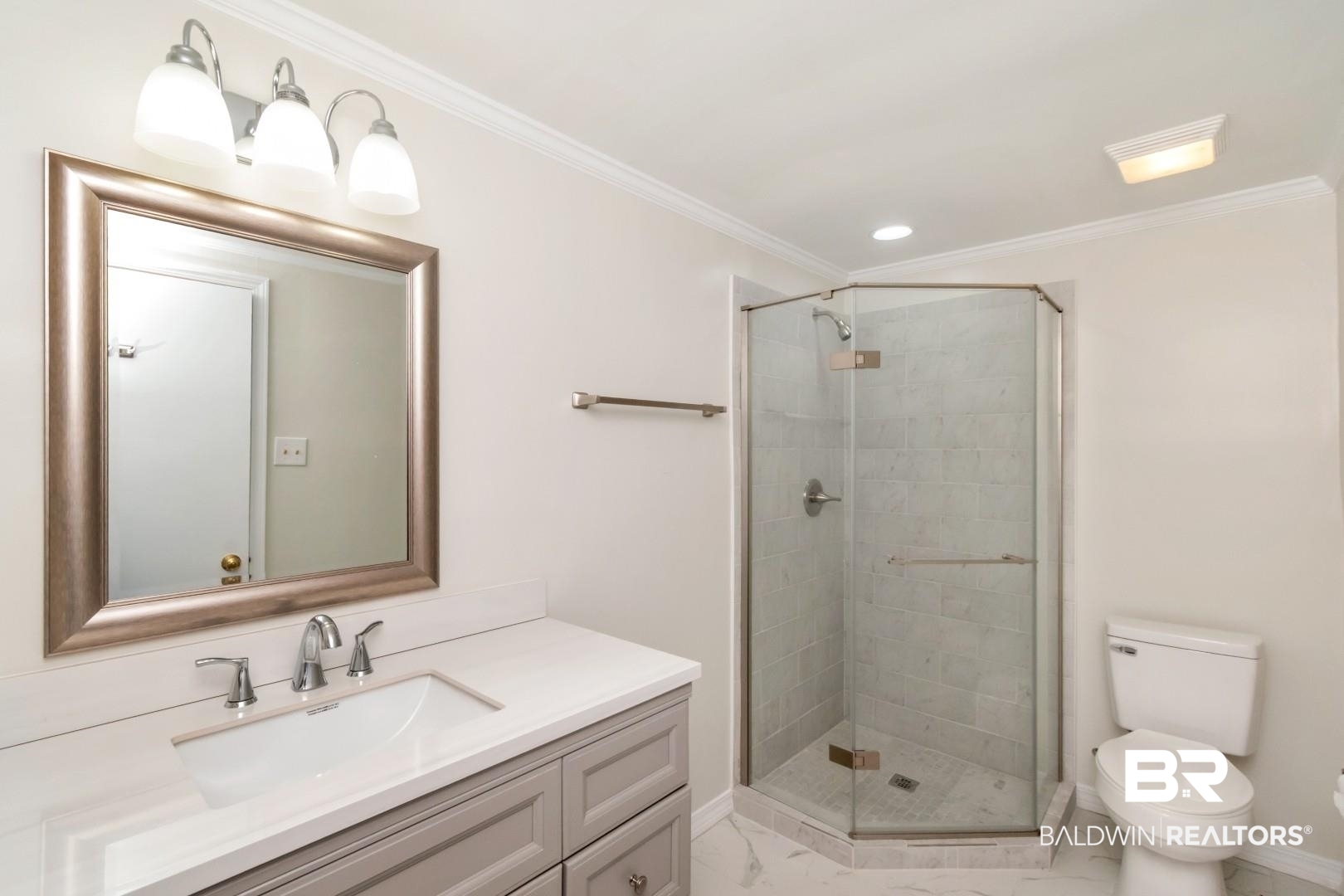 2105 Upham Court Mobile, AL 36607 - Photo 22 of 32 Bathroom featuring vanity, a shower stall, ornamental molding, recessed lighting, and light marble finish floors