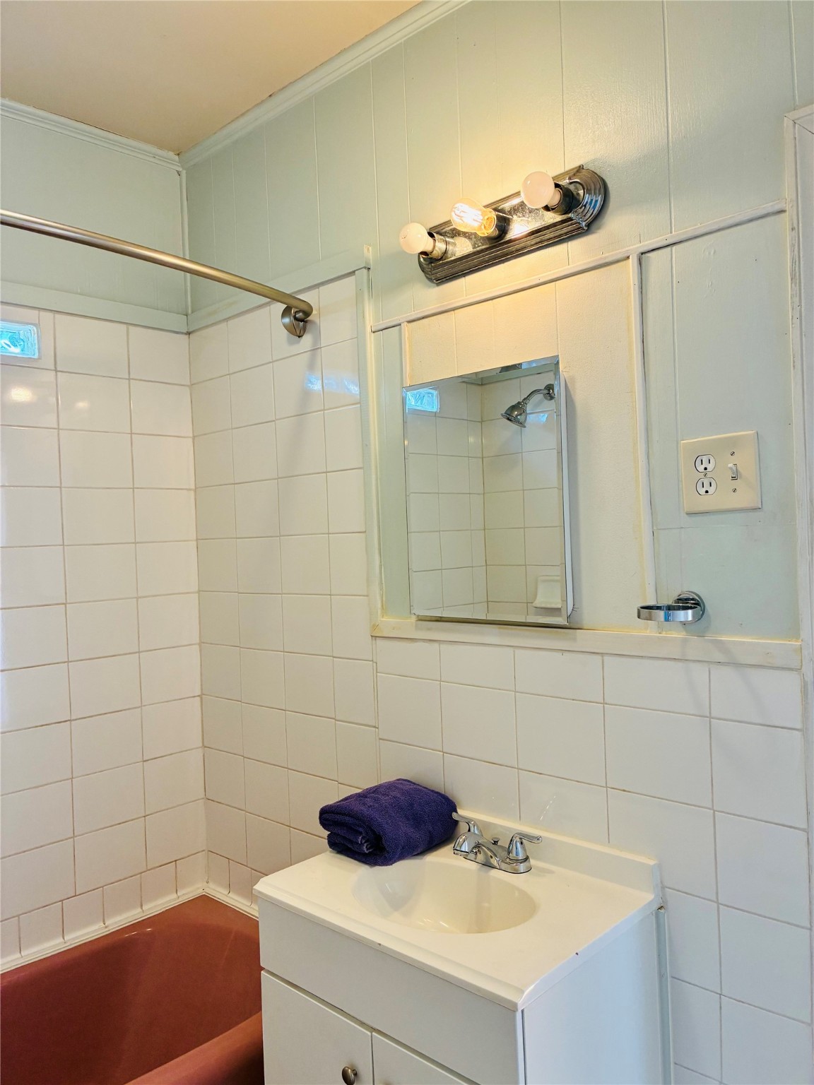 702 Caplin Street Houston, TX 77022 - Photo 15 of 18 a bathroom with a sink and a mirror