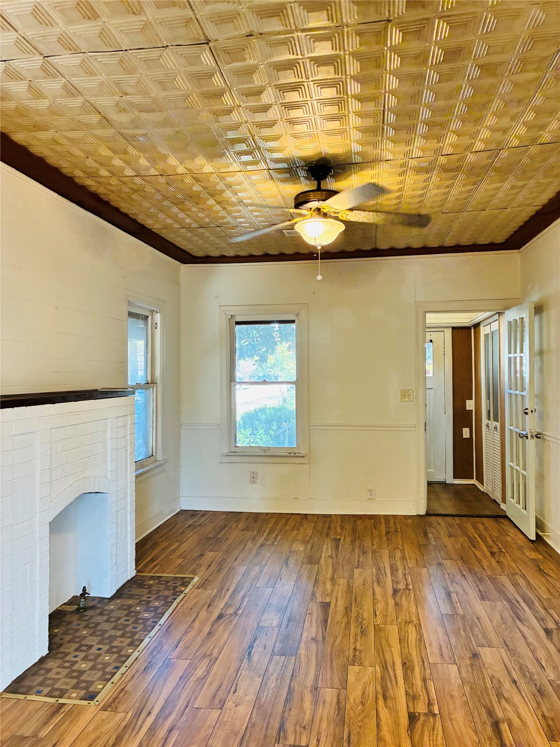 702 Caplin Street Houston, TX 77022 - Photo 6 of 18 a view of empty room with wooden floor