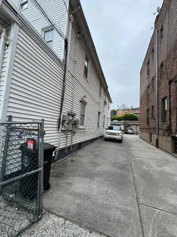 a view of a truck parked in front of a white house