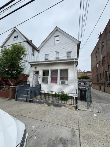 a front view of a house with a garage