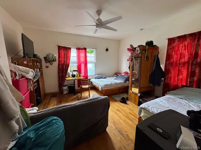 a bedroom with furniture and a closet
