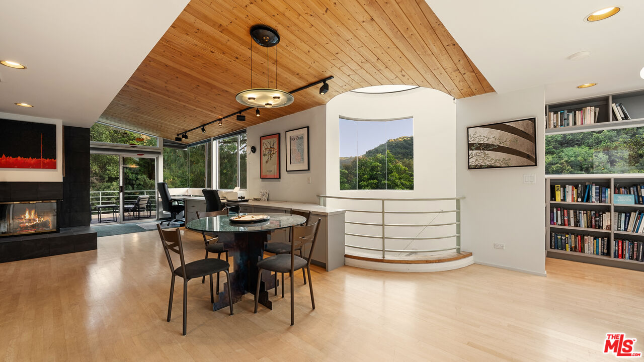 13044 Sky Valley Road Los Angeles, CA 90049 - Photo 11 of 29 a dining room with furniture and window