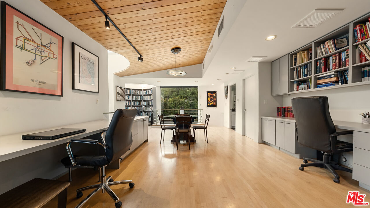 13044 Sky Valley Road Los Angeles, CA 90049 - Photo 14 of 29 a view of a workspace with furniture and a workspace