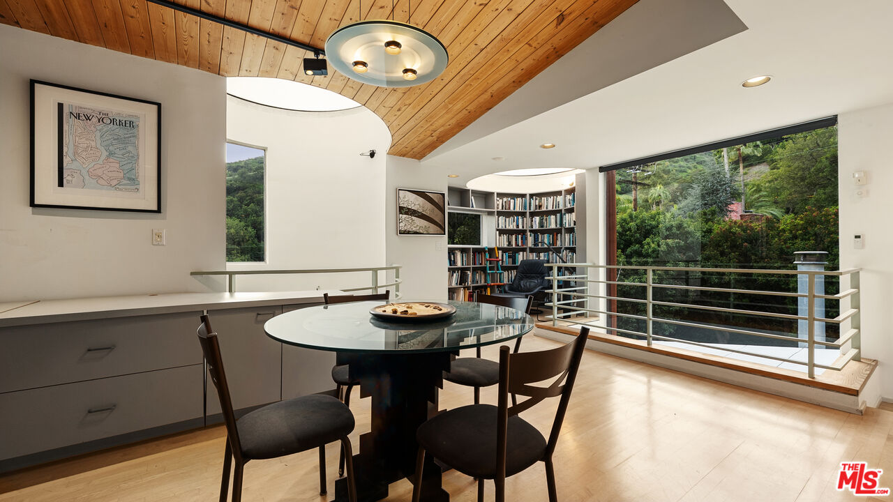 13044 Sky Valley Road Los Angeles, CA 90049 - Photo 15 of 29 a dining room with furniture and window