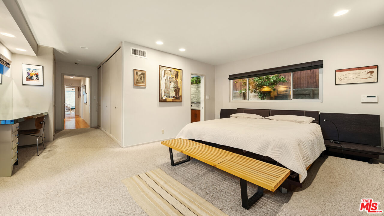 13044 Sky Valley Road Los Angeles, CA 90049 - Photo 19 of 29 a bed room with a bed and a tv