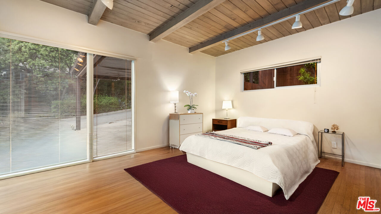 13044 Sky Valley Road Los Angeles, CA 90049 - Photo 23 of 29 a large white bed in a white room