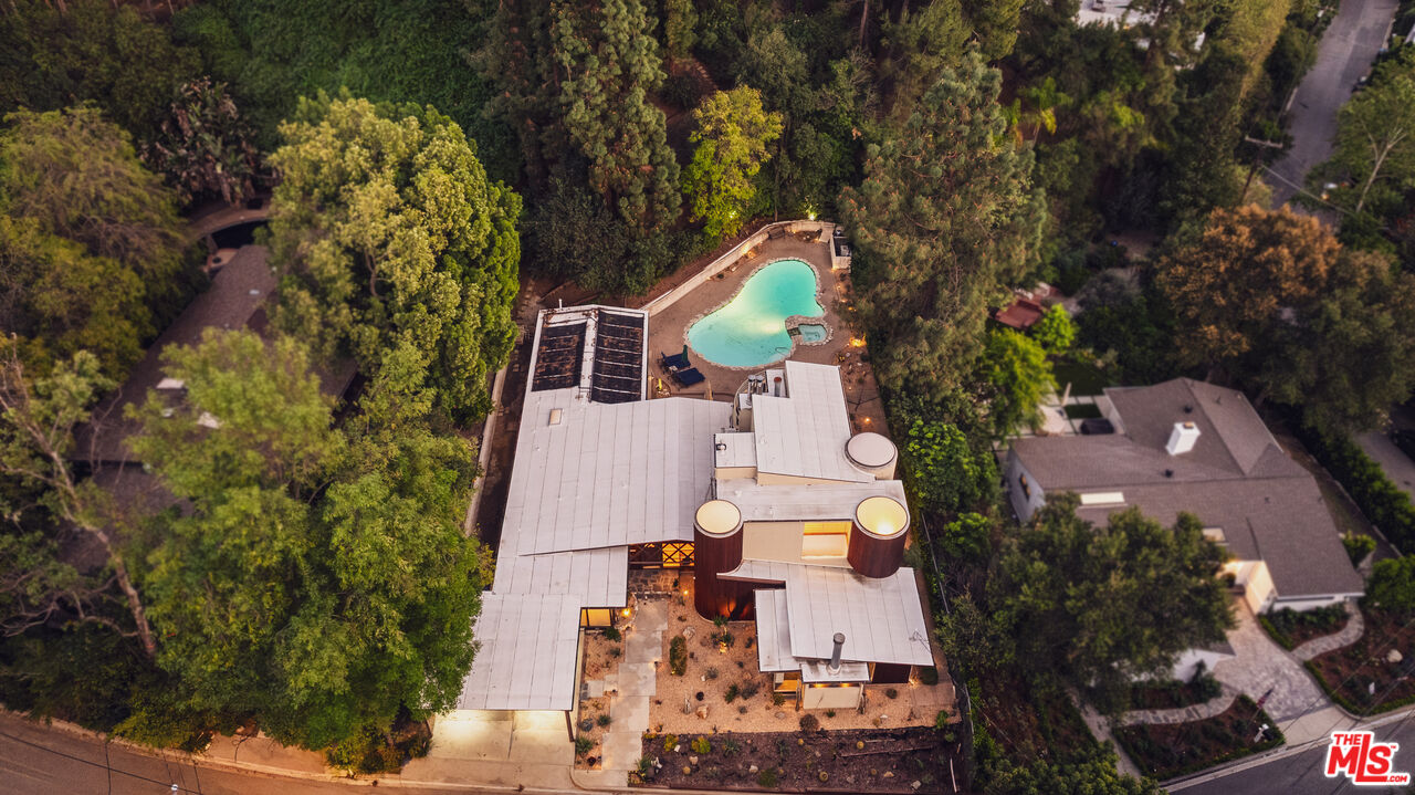 13044 Sky Valley Road Los Angeles, CA 90049 - Photo 27 of 29 an aerial view of house with yard swimming pool and outdoor seating