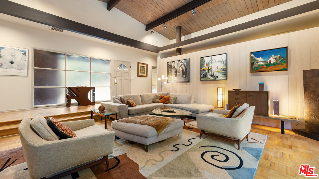 13044 Sky Valley Road Los Angeles, CA 90049 - Photo 3 of 29 a living room with furniture and a couch