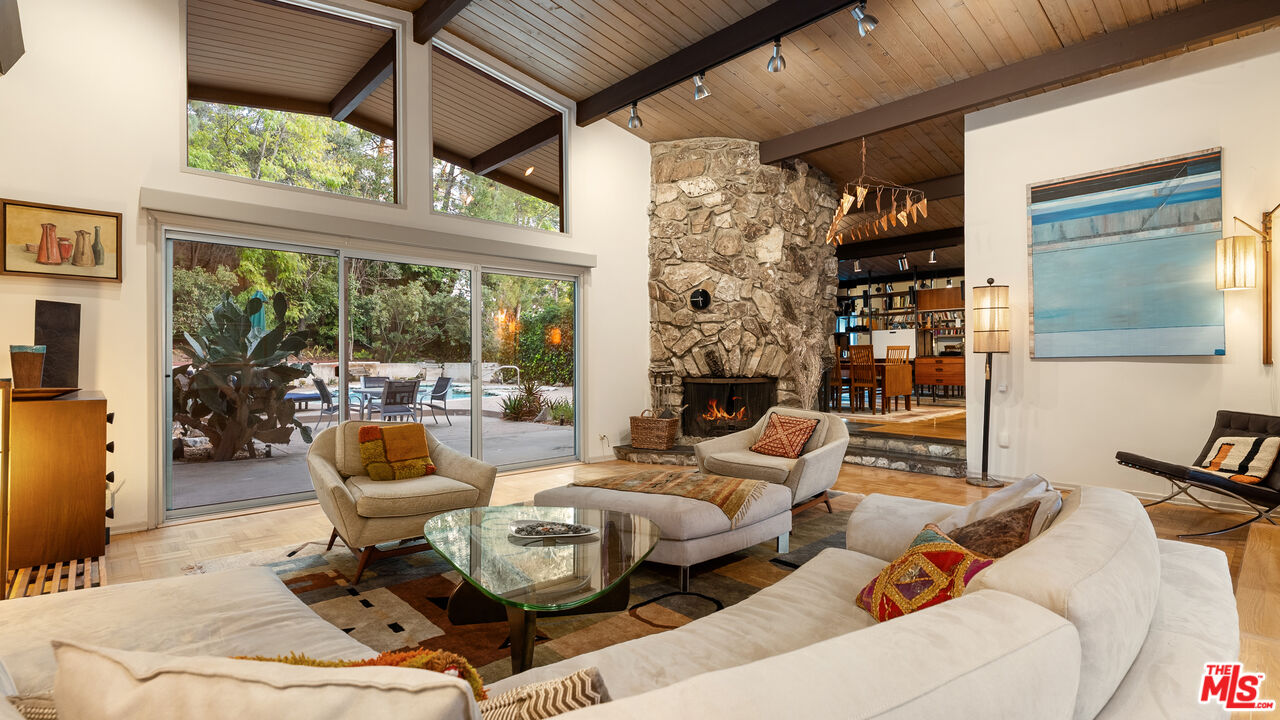 13044 Sky Valley Road Los Angeles, CA 90049 - Photo 6 of 29 a living room with furniture and a large window