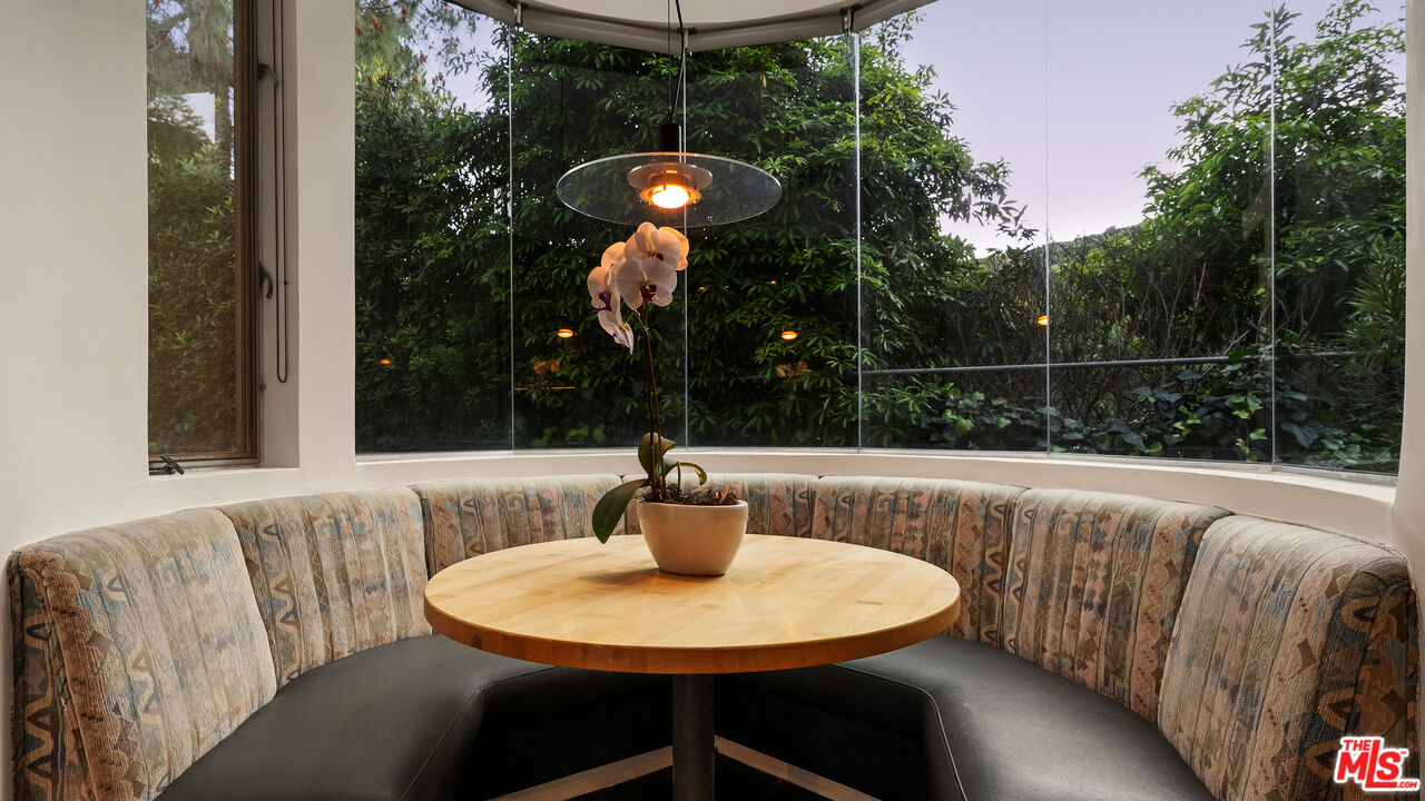 13044 Sky Valley Road Los Angeles, CA 90049 - Photo 10 of 29 a view of table and chair in the patio