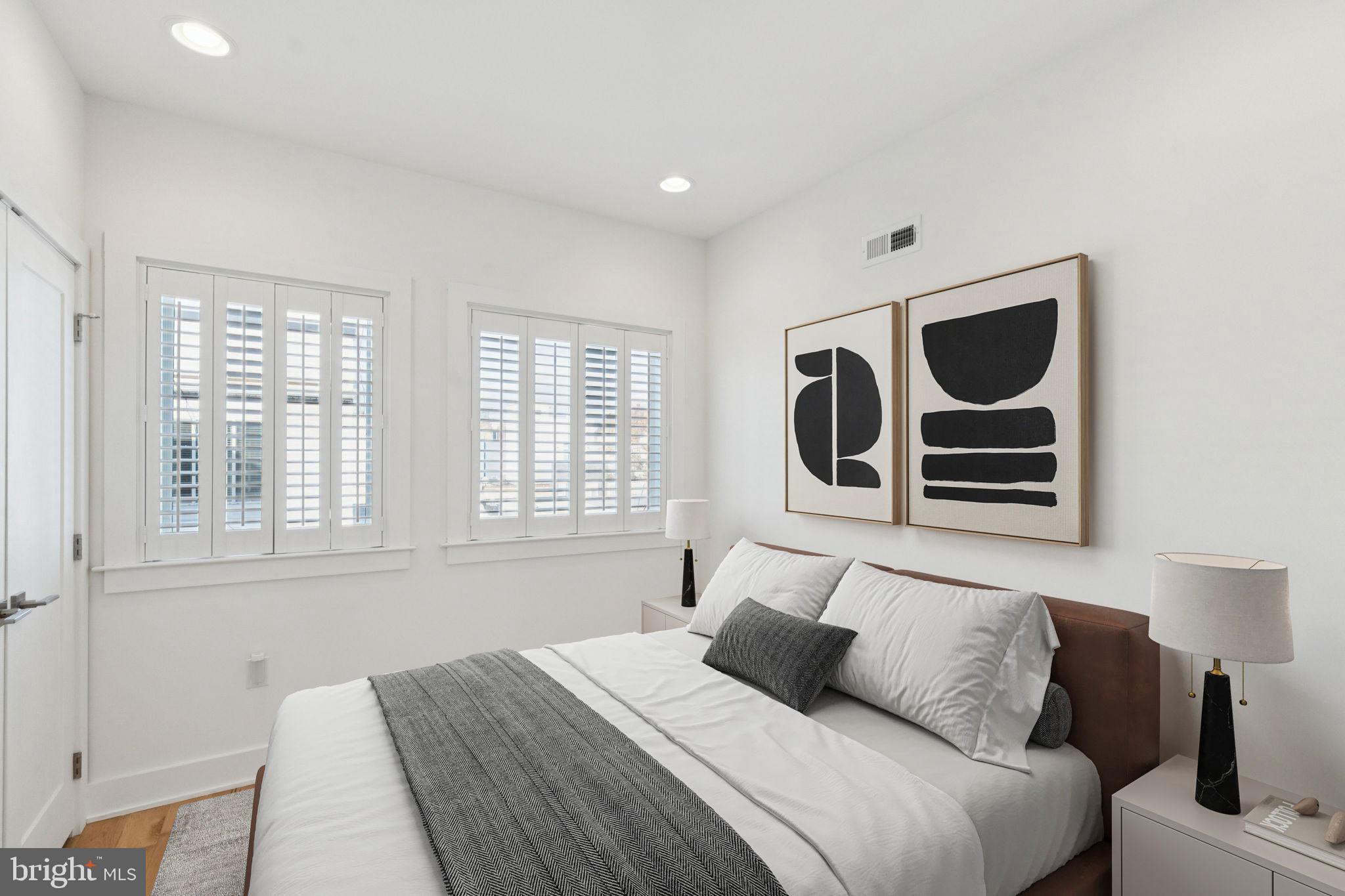 1825 Gerritt Street Philadelphia, PA 19146 - Photo 14 of 34 a bedroom with a bed and cabinets